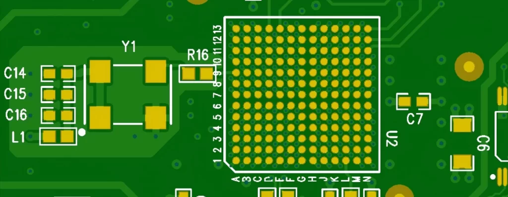 Close-up of a printed circuit board showing clear white silkscreen markings for component reference designators, polarity, and pin 1.