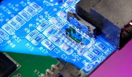 Automated conformal coating application on printed circuit board for moisture protection