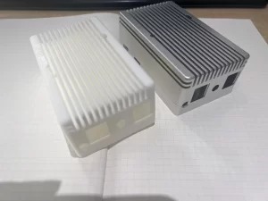 Side-by-side comparison of AL6061 CNC-machined vs. 3D-printed enclosures for Raspberry Pi CM4 industrial applications showing precision surface finish, tolerances, and durability differences