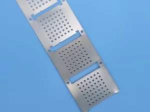 Array of custom EMI shielding covers after photo etching process, ready for PCB assembly in electronics manufacturing services