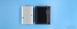 Finished PCBA fully integrated into an industrial enclosure during final production introduction of EMS box build assembly – visible RF cable and connectors, mounting points, and completed solder joints.